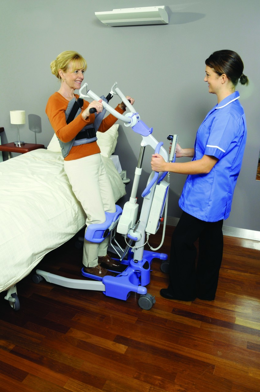 Patient and carer using a mobile hoist